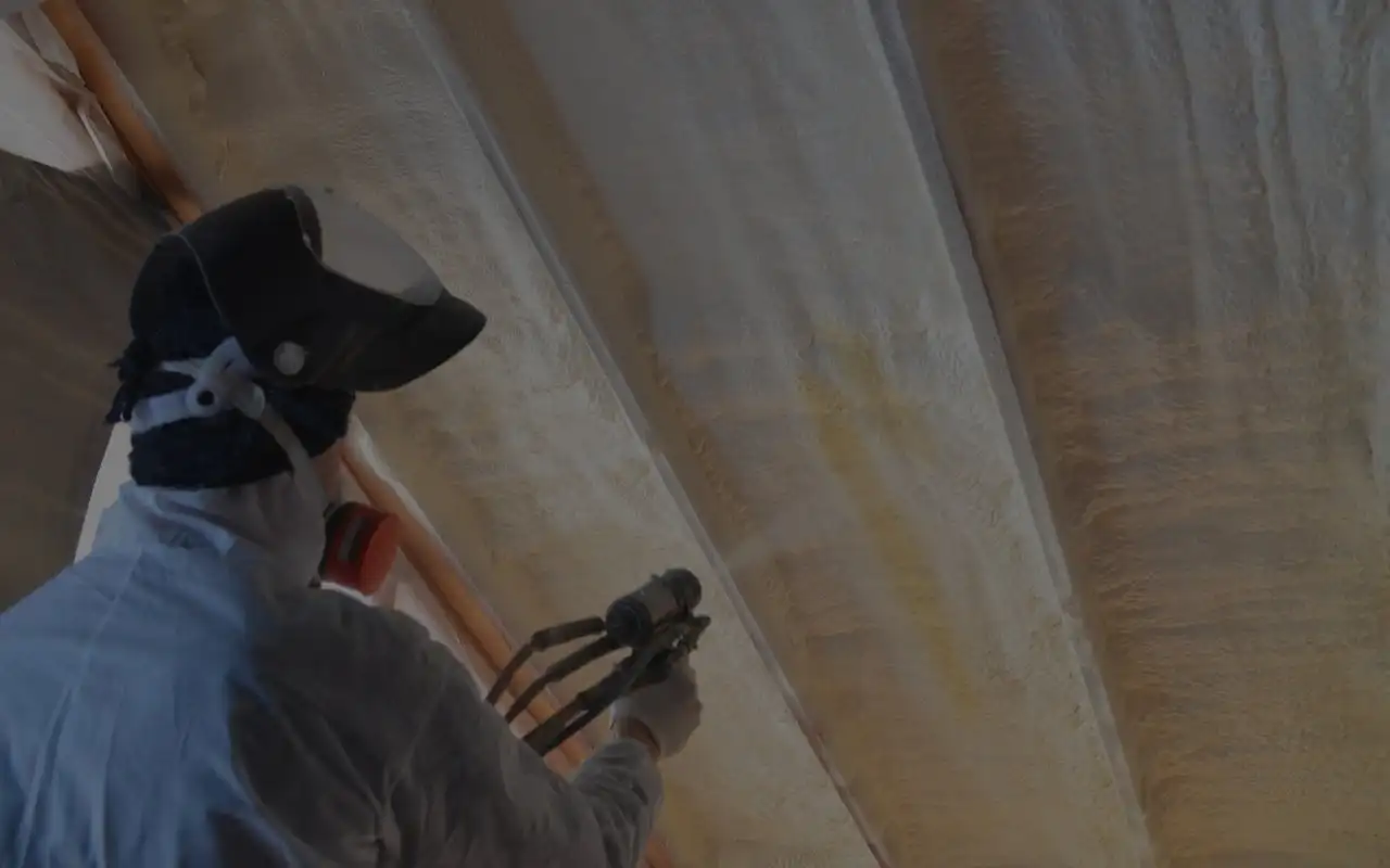 Spray foam insulation installed in a framed building assembly