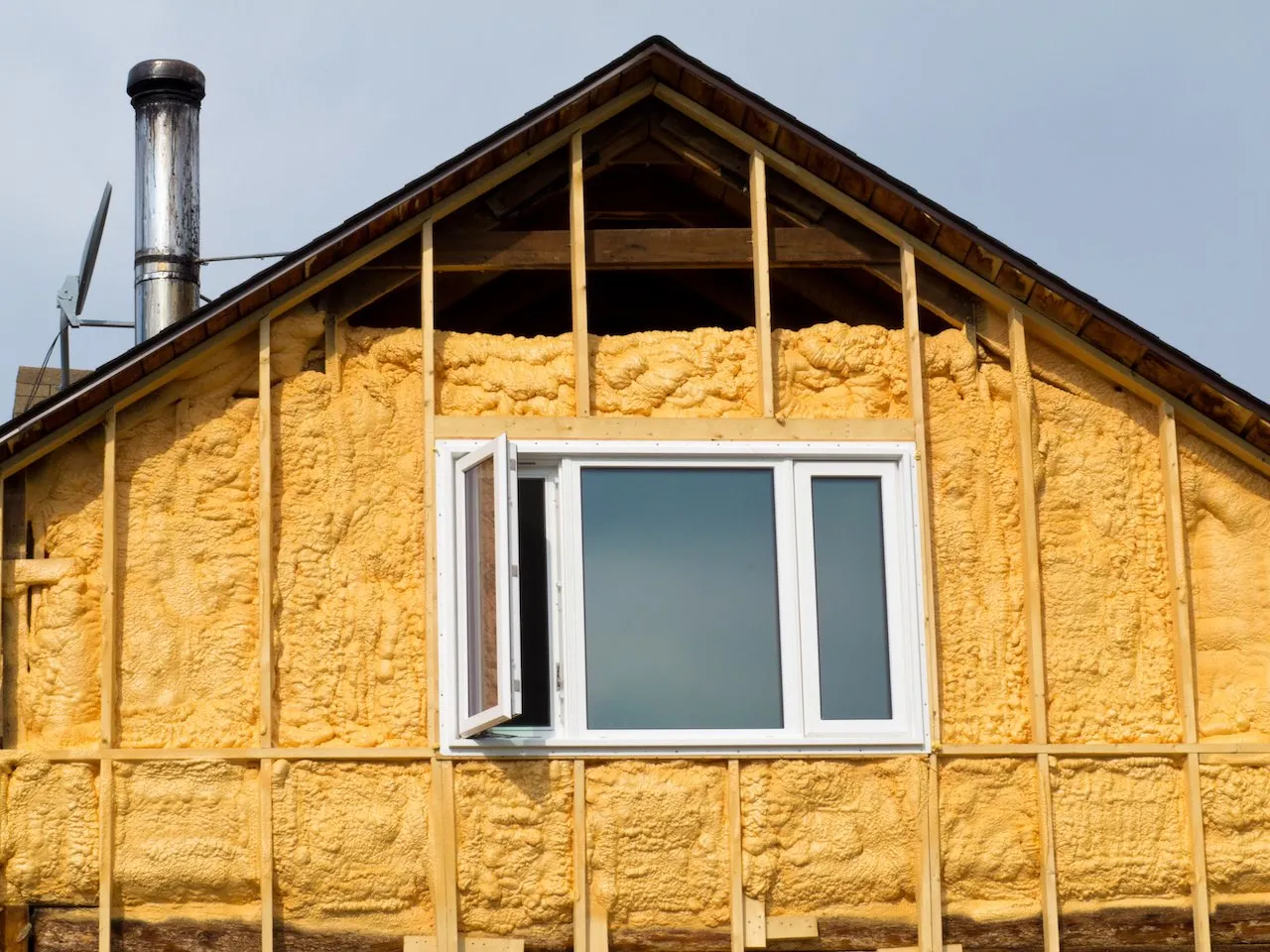 Spray foam around building framing
